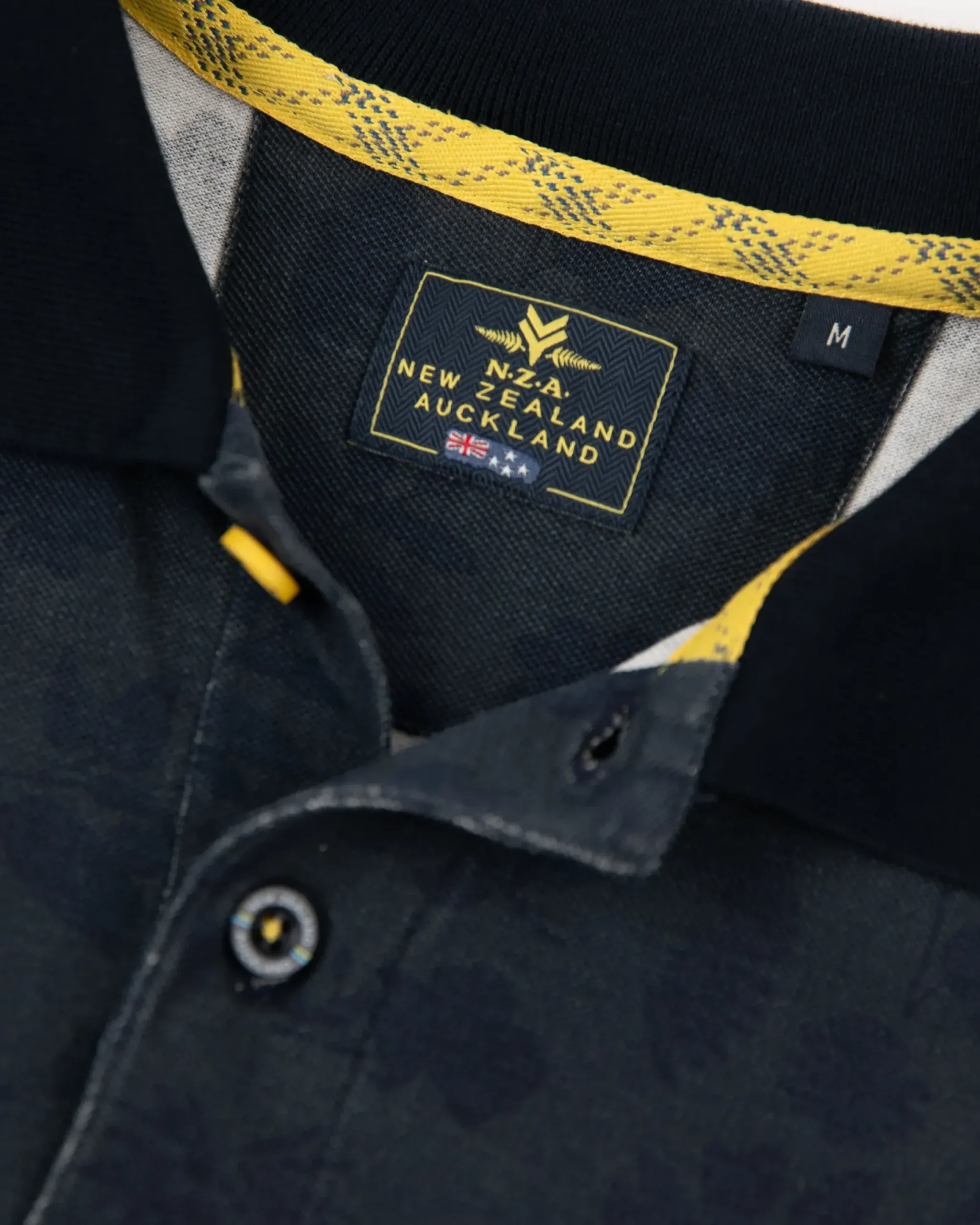 Donkerblauwe polo met bladprint