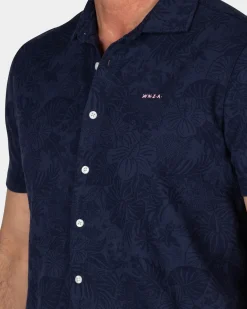 Donkerblauw overhemd met korte mouw en bloemprint