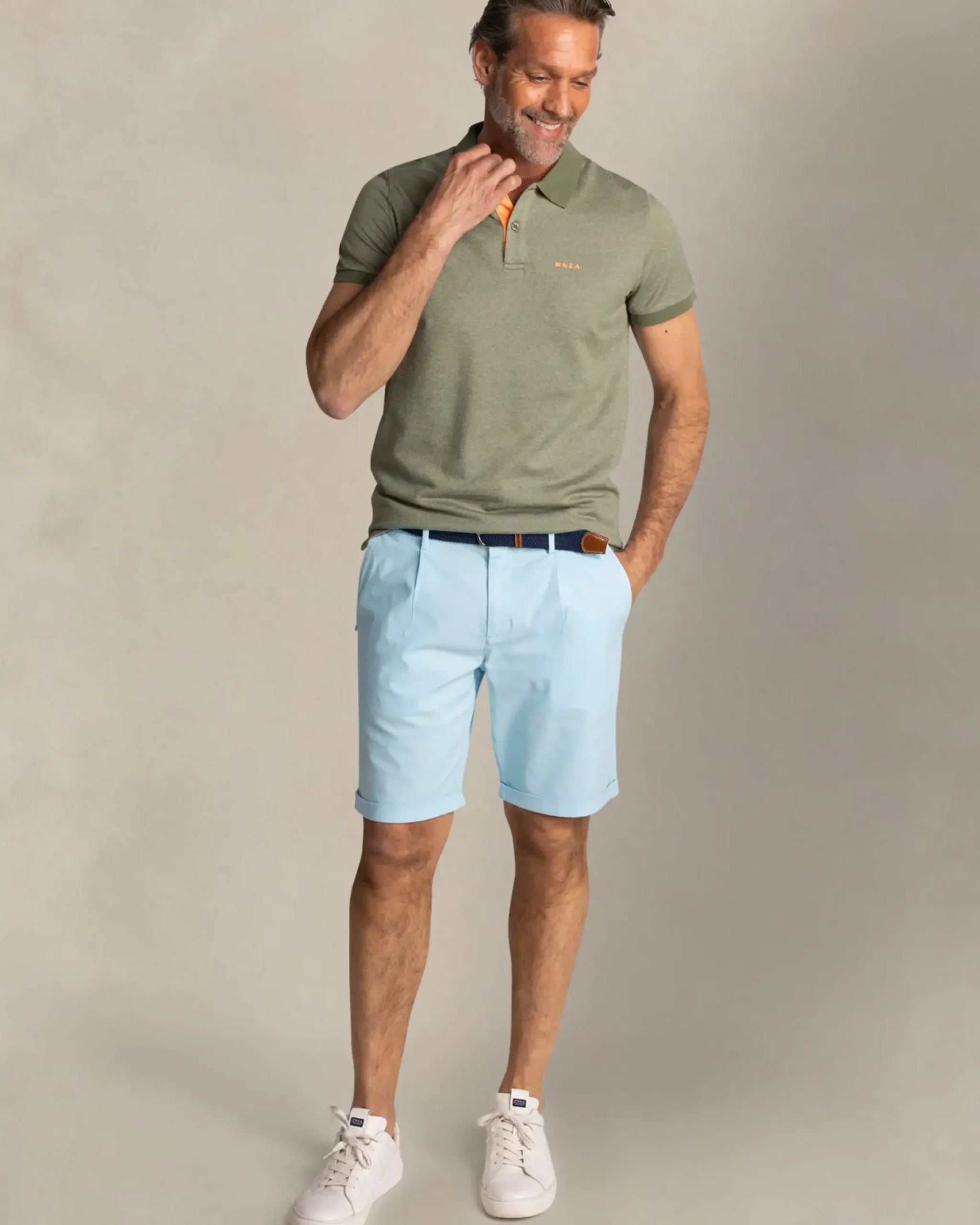 Effen groene polo met oranje details