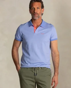 Effen lichtblauwe polo met oranje details