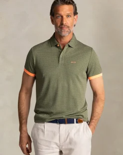 Groene polo met kleine oranje stippen