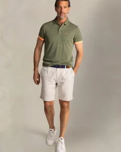 Groene polo met kleine oranje stippen