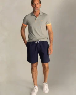 Groene polo met oranje details