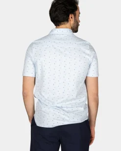 Katoenen pastelblauwe polo met kleine stippen