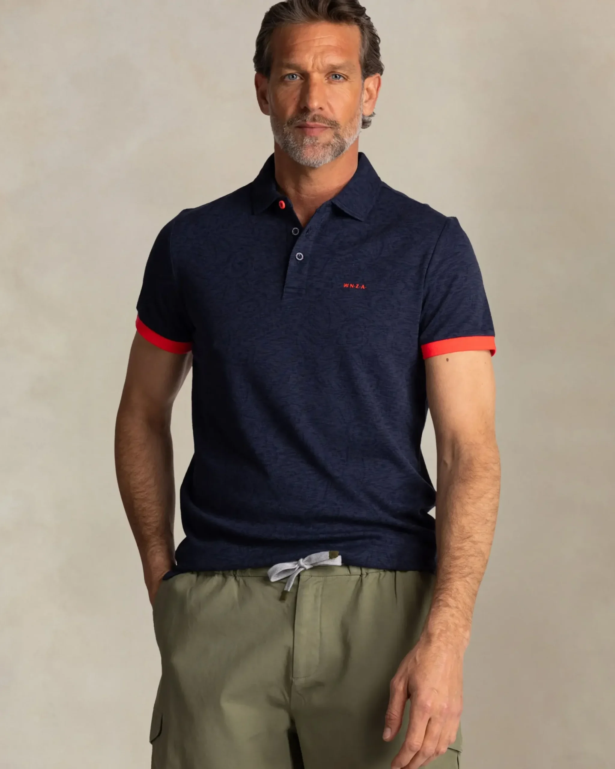 Navy polo met bladprint