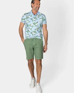 Pastelblauwe polo met grote bloemenprint